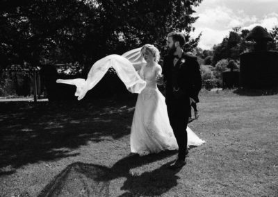 bride and groom walking in garden