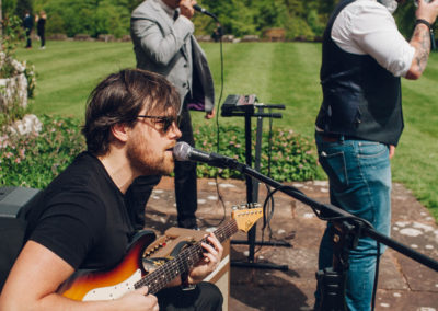 band playing in garden at wedding