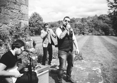 band playing in garden at wedding